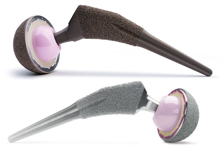 This is a side-by-side comparison of a darker Zimmer Biomet iodine-coated total hip system at the top and a lighter uncoated system shown below.